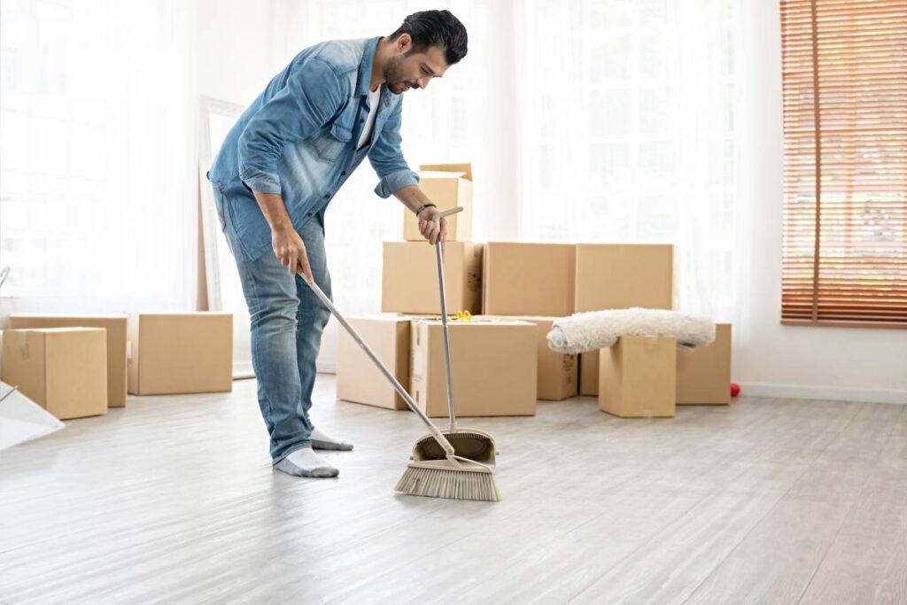 1668639610012 a man cleaning a house before moving out